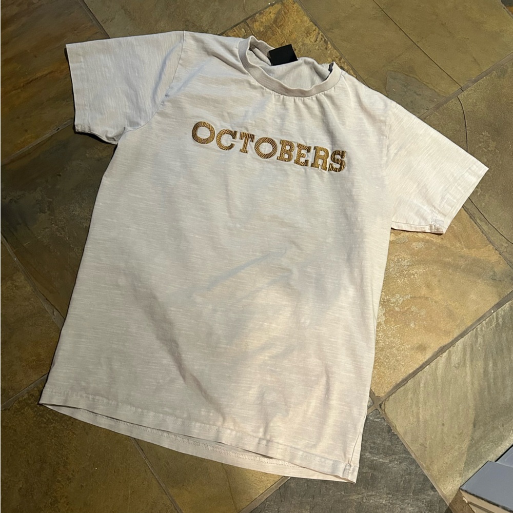 OVO Beige Short Sleeve Tee.  Embroider Octobers on the front.